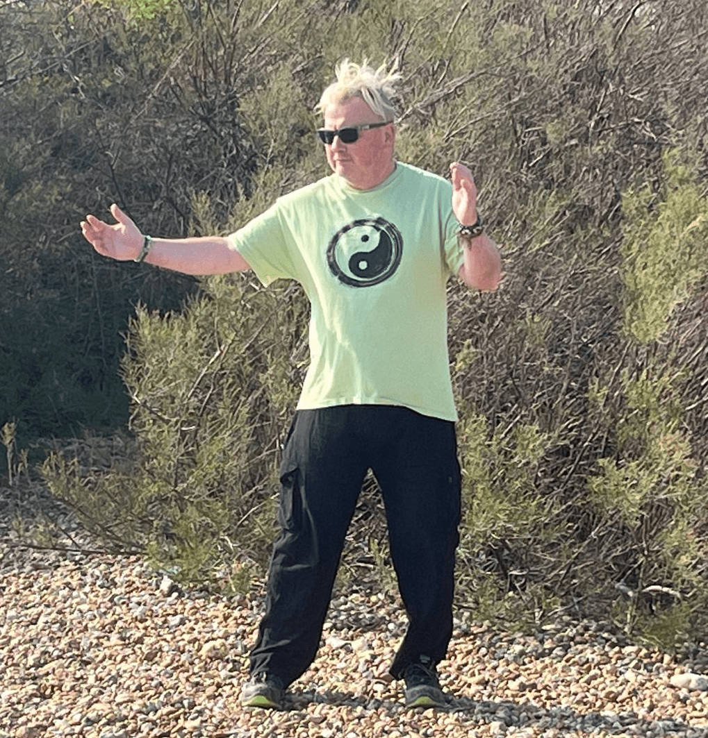 Darren, painting a rainbow. Qigong on East Preston beach